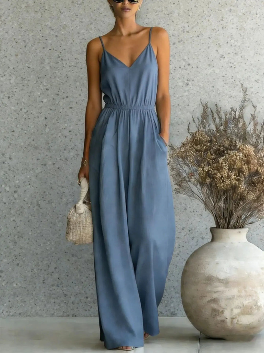 Effortless women's casual wide leg V-neck jumpsuit. A comfortable sleeveless one-piece for any occasion.