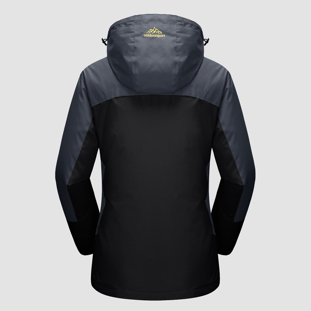 Woman enjoying a mountain view, wearing her Verona 3-in-1 waterproof jacket, ideal for active women.