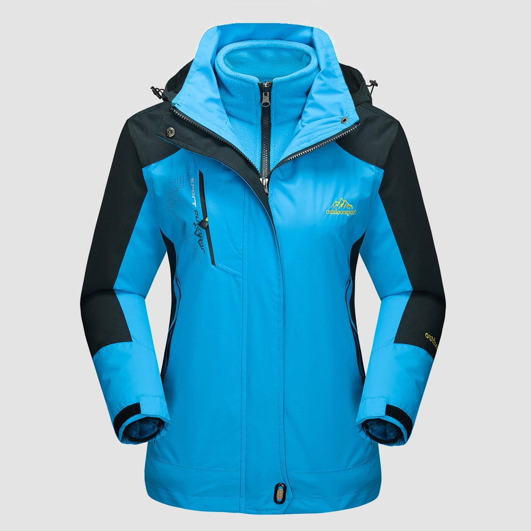 Lifestyle image of a woman enjoying a rainy day, protected by her hooded Verona 3-in-1 waterproof jacket.