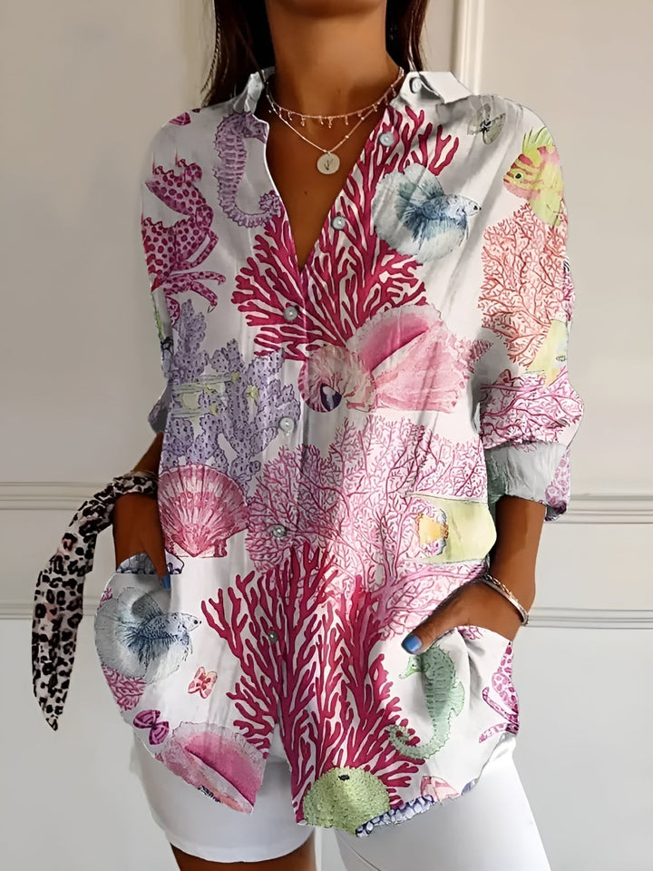 Versatile women's fashion top: abstract print, split neck, long sleeve, button front.