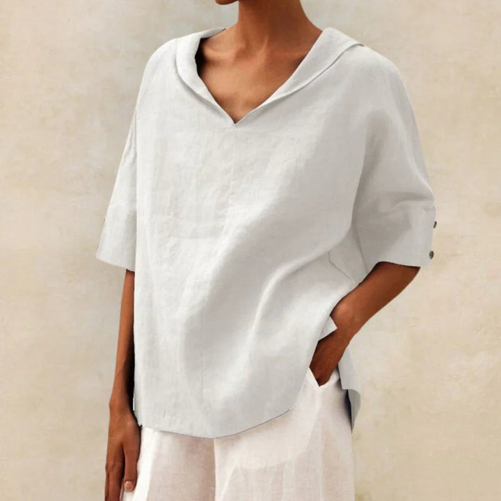 Women's versatile summer shirt with roll-up sleeves, button front, and pointed collar.