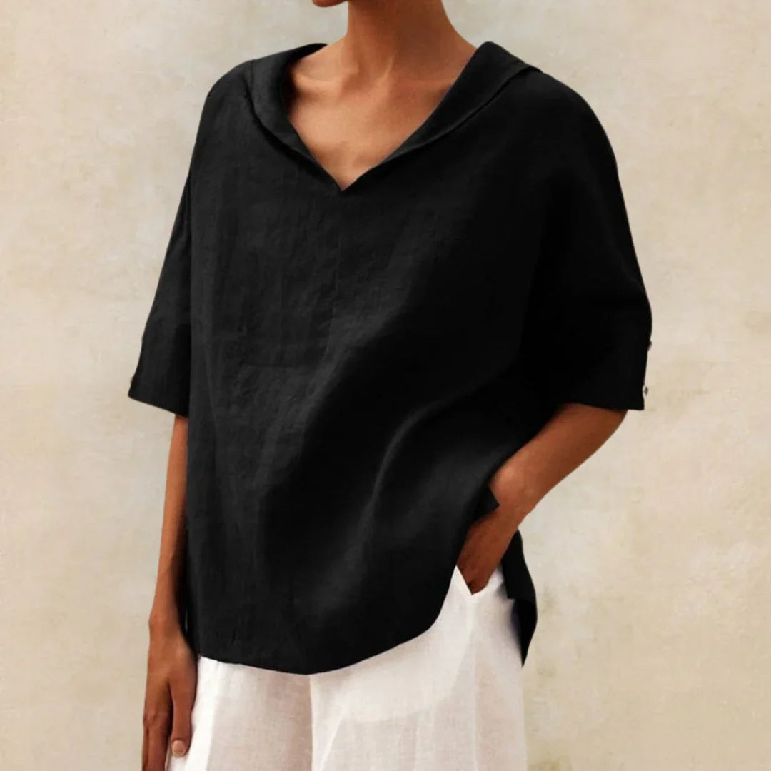 Stylish women's relaxed fit summer top with roll-up sleeves, perfect for casual everyday wear.