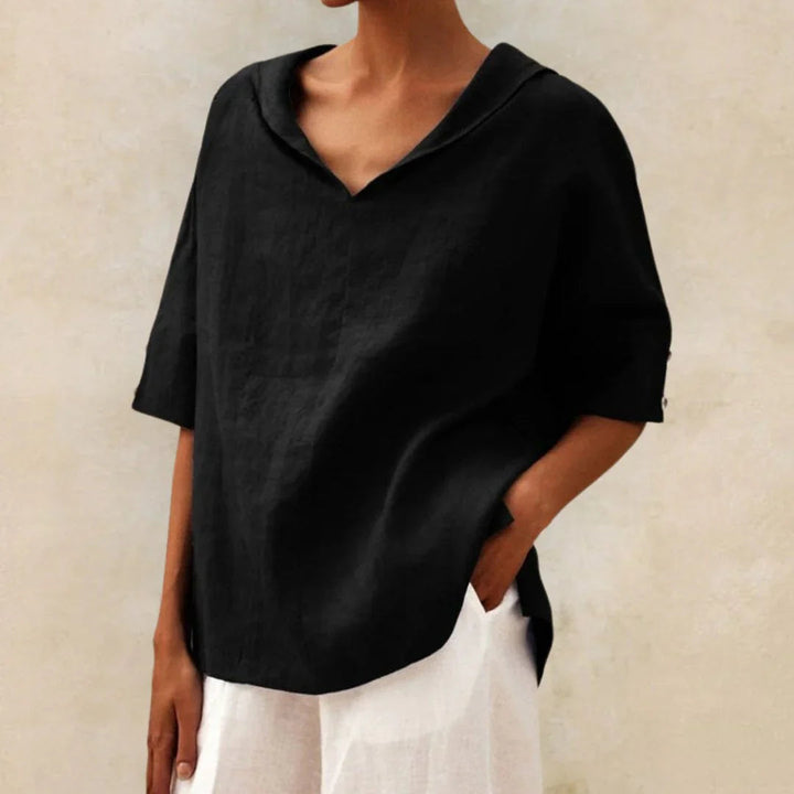 Stylish women's relaxed fit summer top with roll-up sleeves, perfect for casual everyday wear.