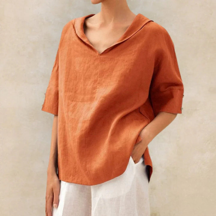 Casual women's blouse with roll-up sleeves, button front, and pointed collar, ideal for spring & summer.