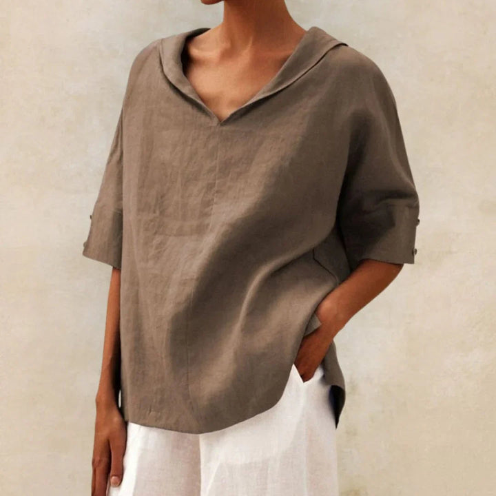 Summer-ready women's top featuring practical roll-up sleeves, relaxed fit, and stylish design.