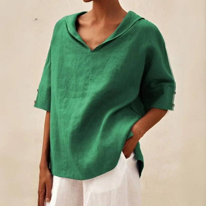 Women's versatile button-front blouse with roll-up sleeves & pointed collar for comfortable everyday wear.