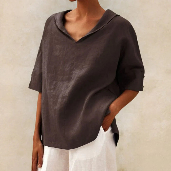Lightweight women's spring/summer top with roll-up sleeves & classic button-front design. A versatile blouse.
