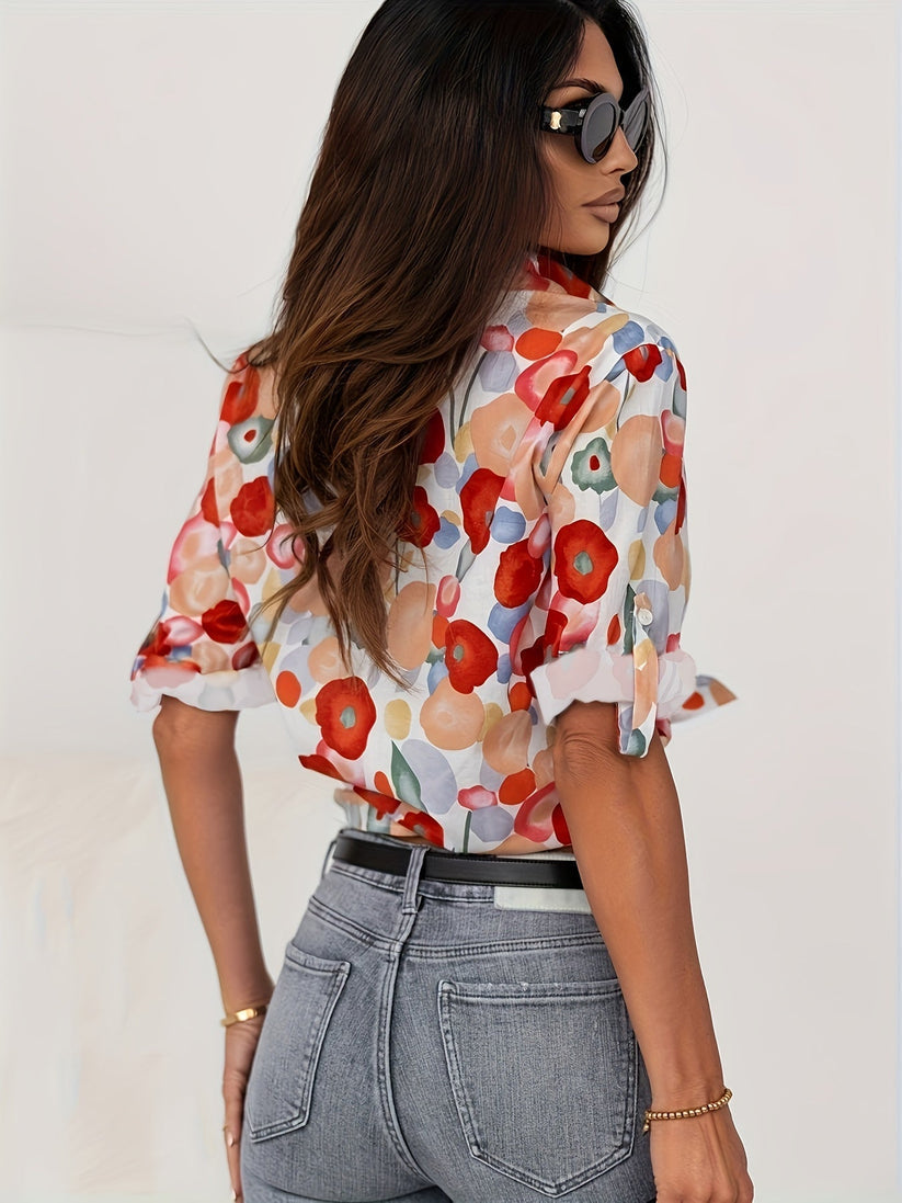 Artistic abstract floral print women's button down blouse, long sleeve. Vibrant, relaxed fit for spring fashion.