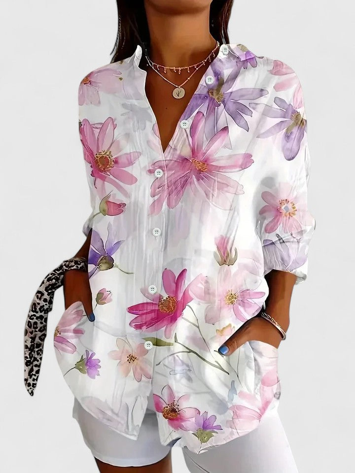 Vibrant floral abstract print women's blouse. Long button-down sleeves, artistic and chic for summer.