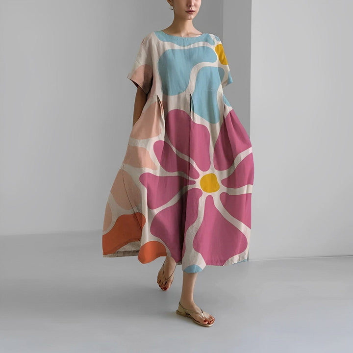Close-up of the vibrant floral print on a comfortable women's maxi dress, ideal for summer fashion.