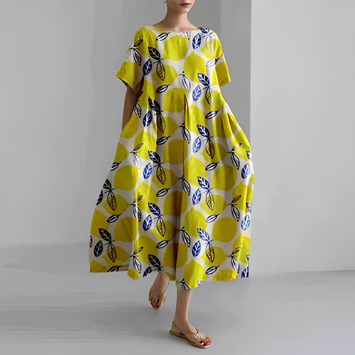 Back view of a women's vibrant floral maxi dress, showcasing its comfortable and flowy summer design.
