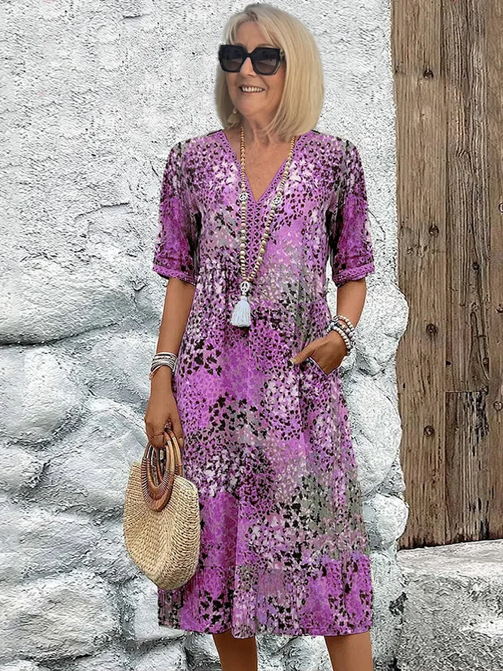 Blush pink vibrant print midi dress, flowy and comfortable. A versatile A-line style for women's summer fashion.