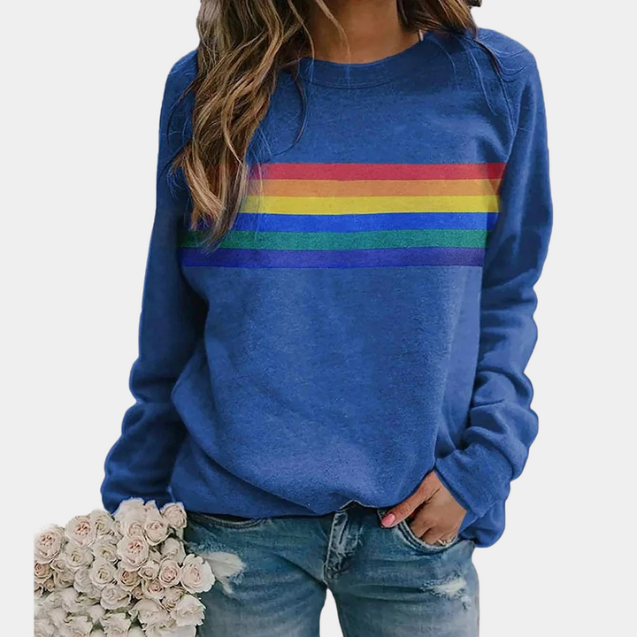 Women's vibrant rainbow stripe crewneck sweatshirt, perfect for casual, comfortable everyday wear. Relaxed fit.