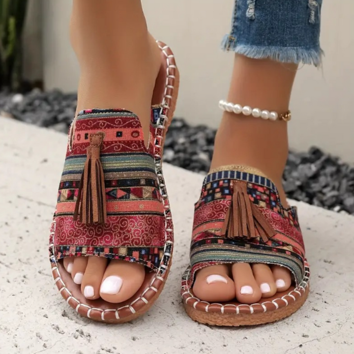 Women's vibrant slip-on flat sandals for comfortable everyday summer wear.