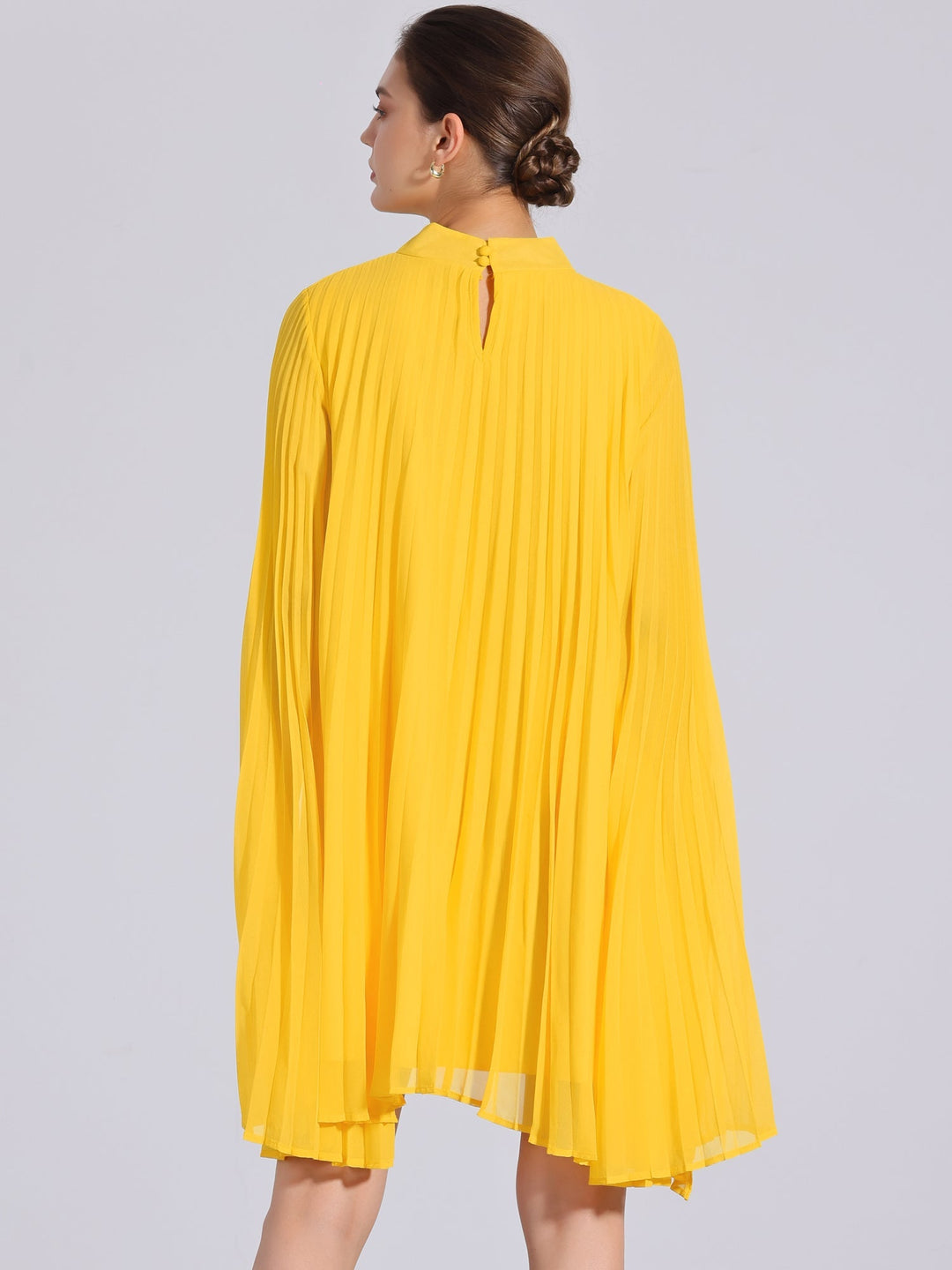 Flowy yellow pleated swing dress for women. Features elegant cape sleeves, a mock neck, perfect for summer parties.
