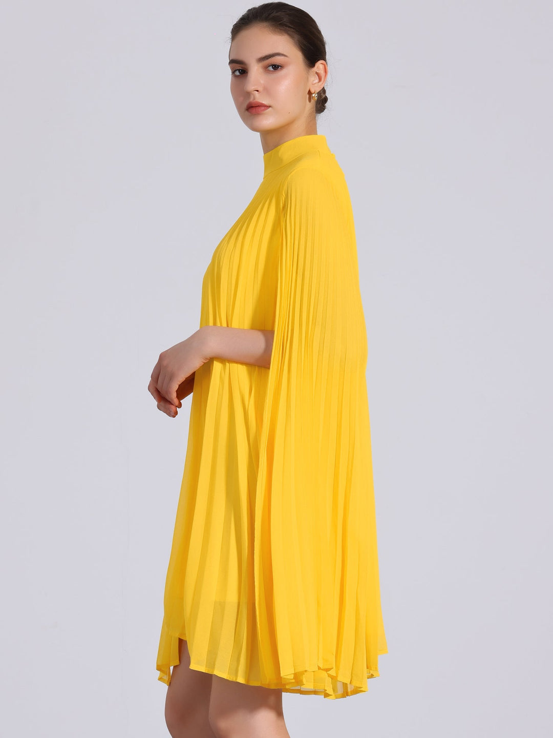 Elegant women's yellow pleated swing dress with unique cape sleeves. Sophisticated mock neck, ideal for special occasions.