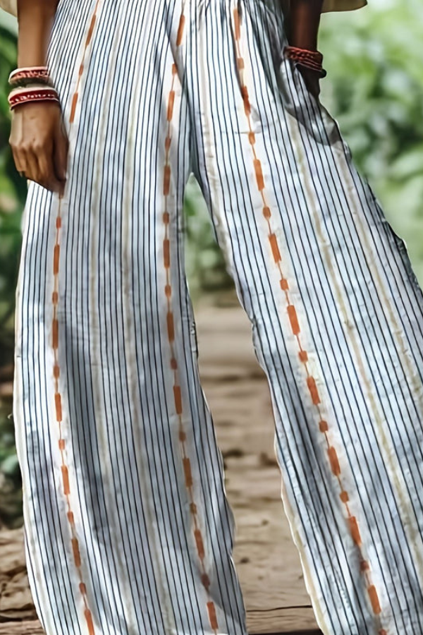 Women's vacation cropped pants, featuring a vibrant floral design and relaxed comfort.