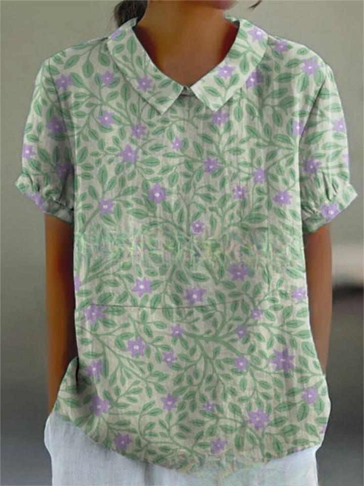 Relaxed fit women's summer top, white with colorful vintage floral embroidery.