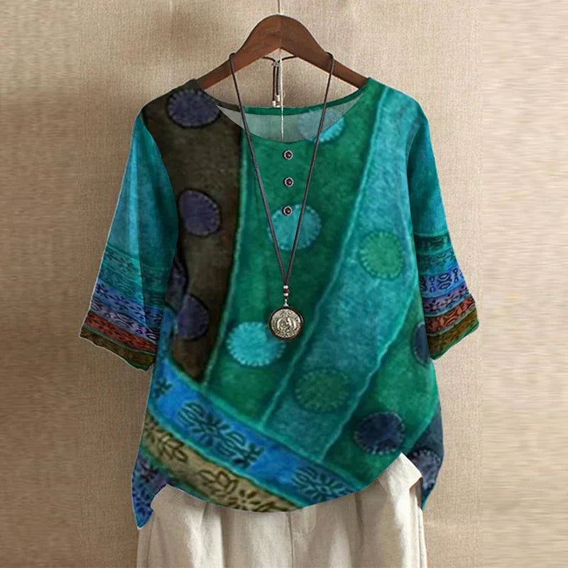 Elegant women's blouse featuring a beautiful vintage floral print and comfortable loose fit, ideal for summer.