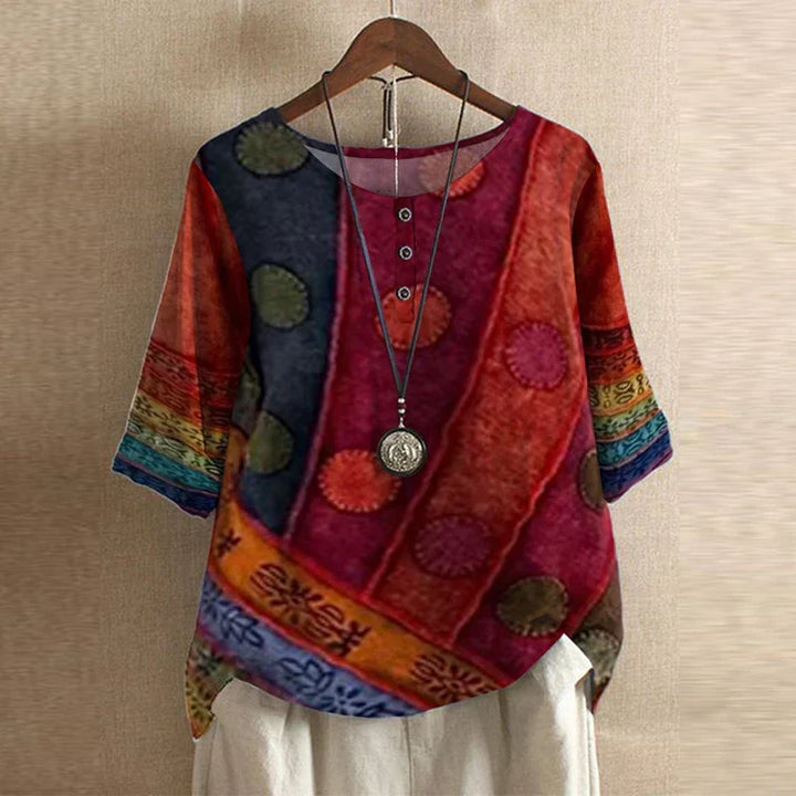 Loose fit women's blouse with a stylish vintage floral print and long sleeves, great for casual wear.