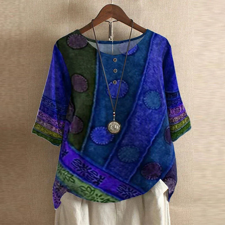 Summer women's blouse: a flowy, loose fit top with a charming vintage floral print and long sleeves.
