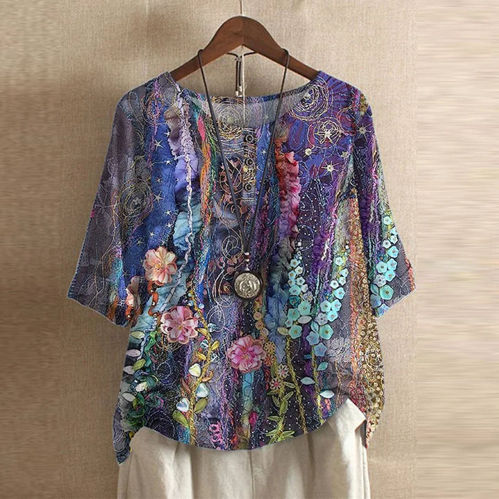 Women's vintage floral print loose fit bohemian summer blouse with long sleeves, casual and flowy.