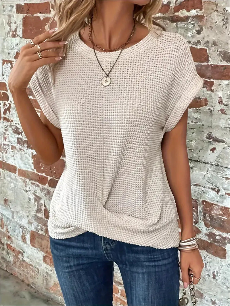 Soft waffle knit women's top with a flattering twist front. Relaxed fit short sleeve for casual comfort.