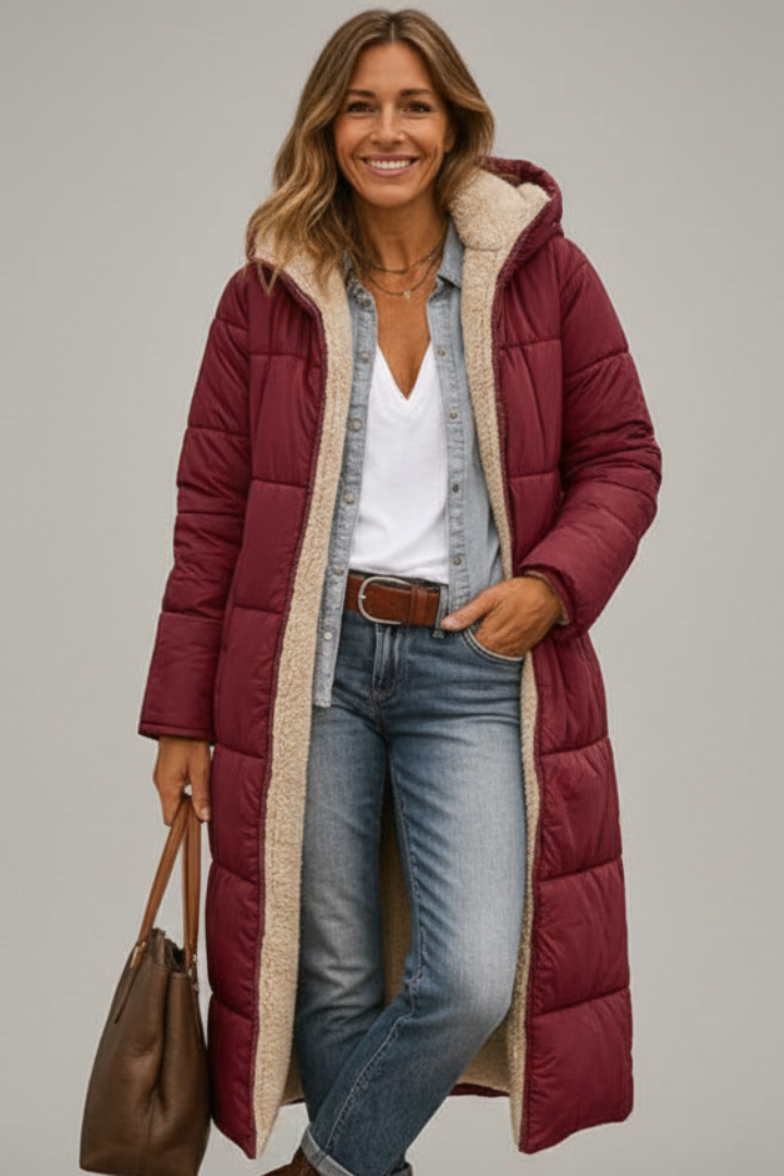 Long women's quilted winter coat, warm and hooded with full zip. Essential cozy outerwear for women.