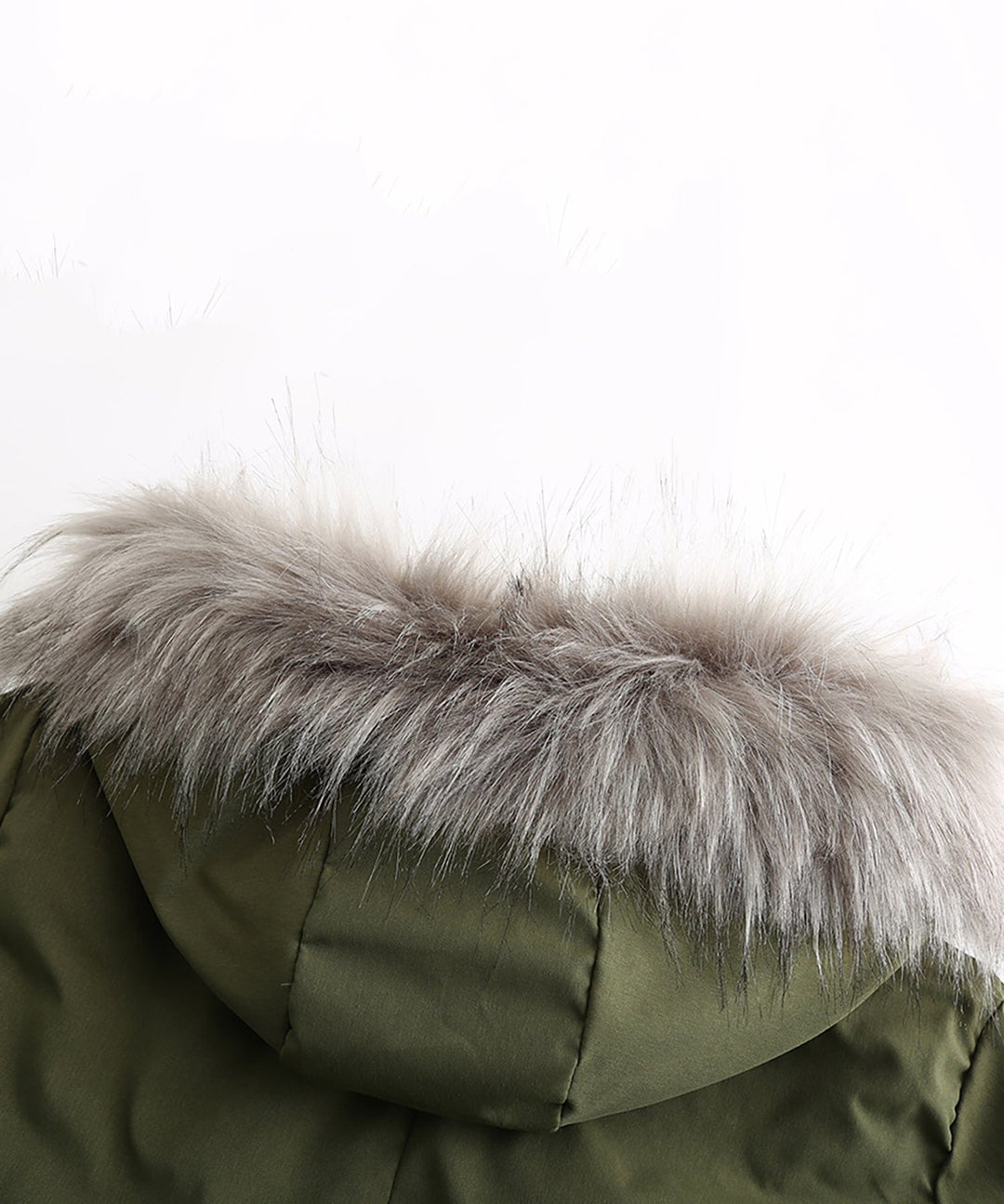 Front zipper closure on a women's warm parka, with protective storm flap