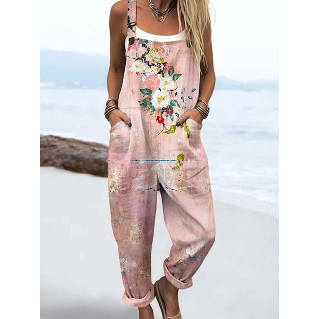 Women's watercolour floral boho casual jumpsuit with adjustable straps, perfect for summer or vacation.