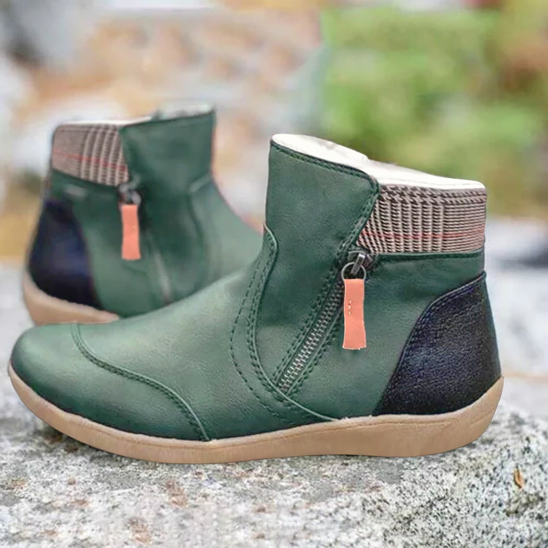 Women's waterproof ankle boots with easy zipper closure, perfect for rain, fall, and winter wear.