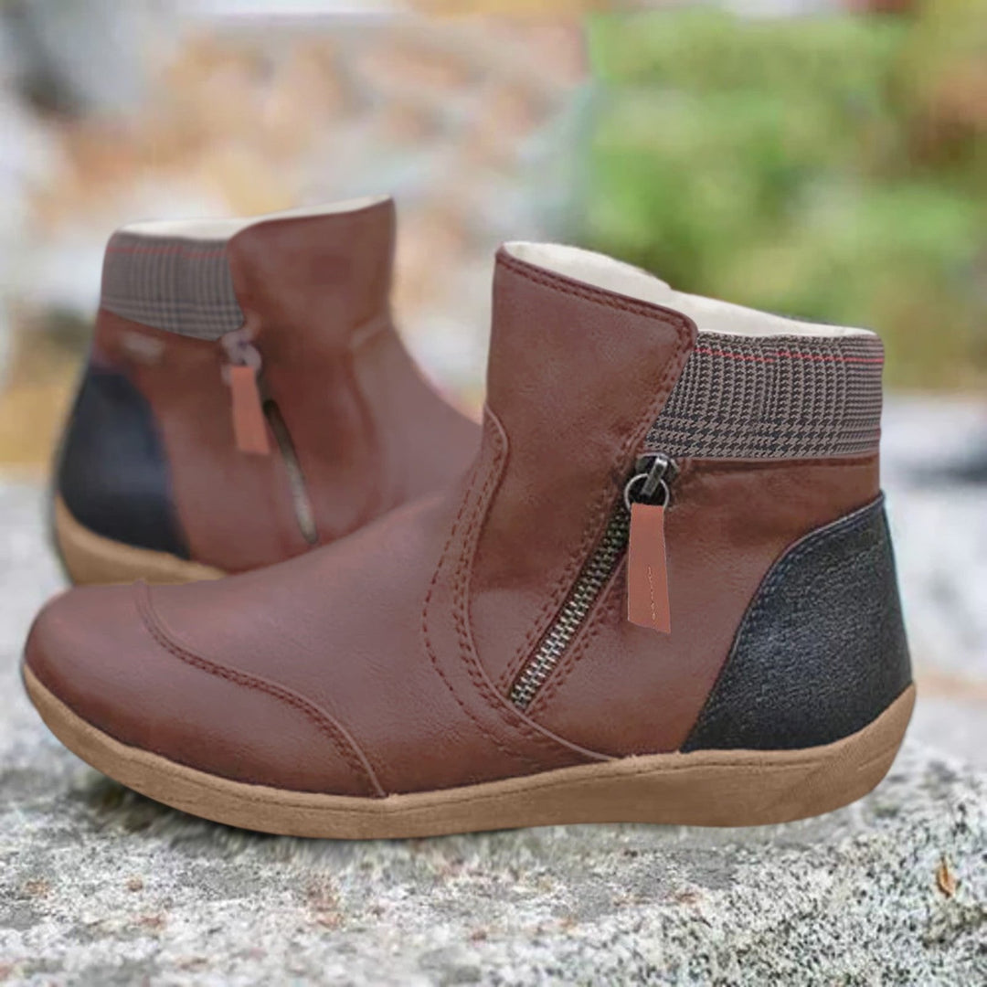 Durable women's waterproof ankle boots with easy zipper. Ideal for outdoor activities & everyday wear in rain or snow.