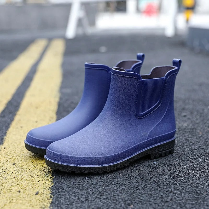 Fashionable women's black waterproof Chelsea platform ankle rain boots. Comfortable slip-on design.