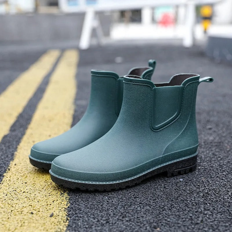 Stylish women's platform rain ankle boots. Waterproof Chelsea design for wet weather comfort.
