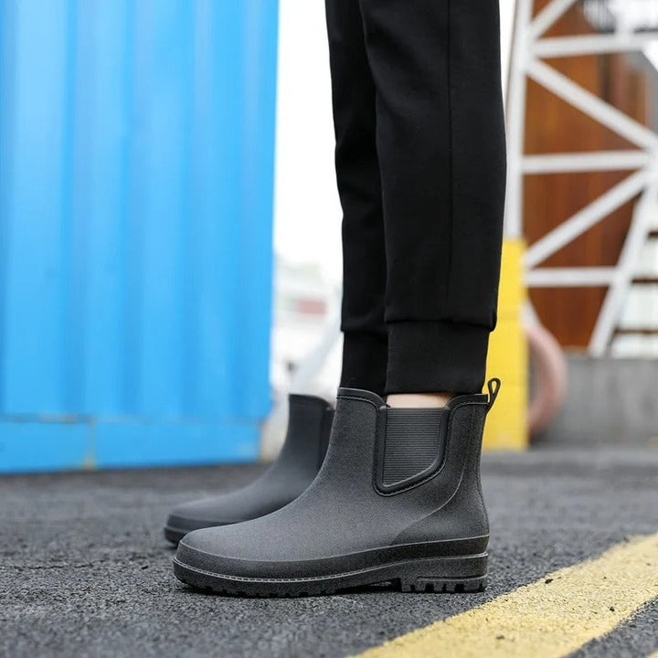 Durable women's waterproof platform rain boots. Black Chelsea ankle style for all weather.