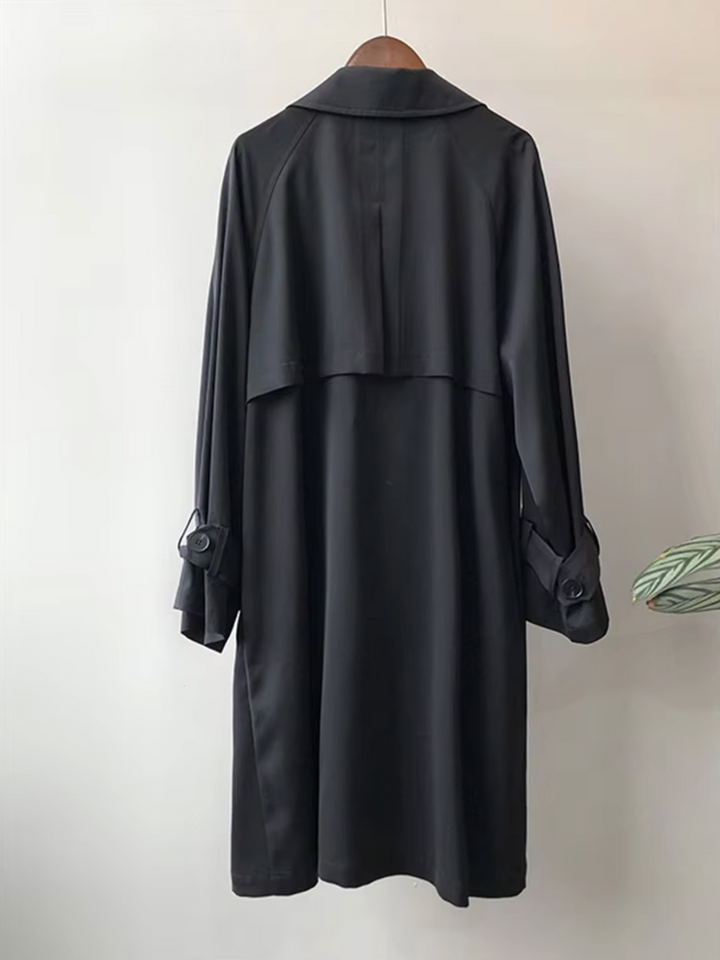 Tailored fit women's waterproof trench coat, double-breasted with a lapel collar, great for business casual.
