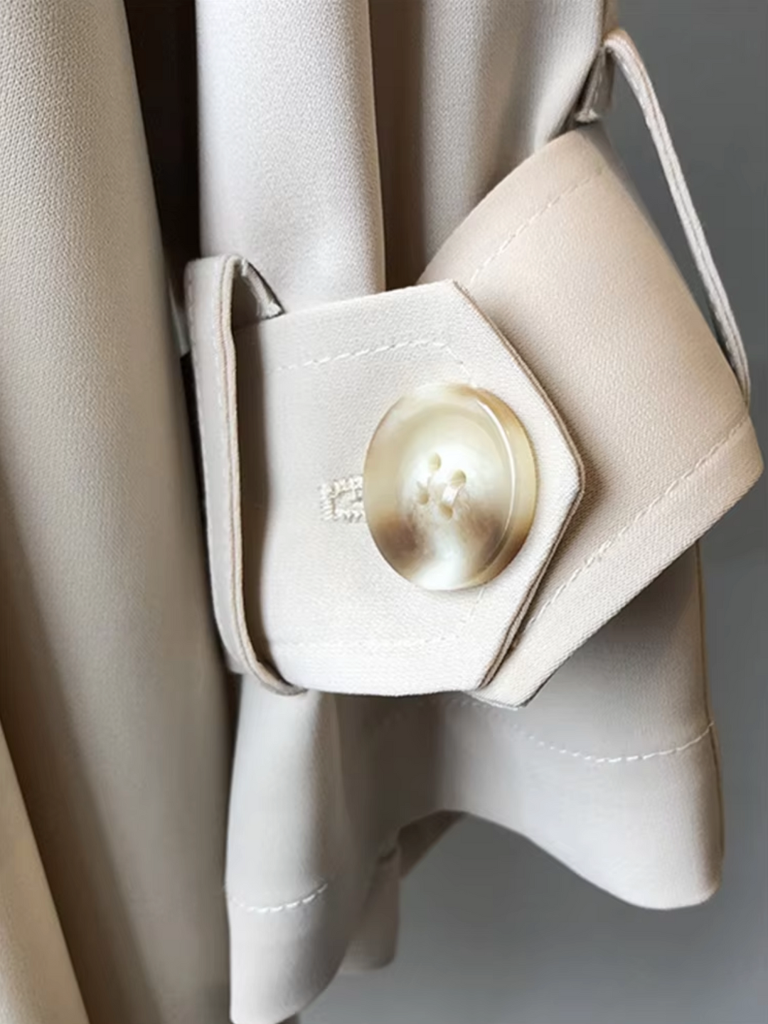 Sophisticated women's waterproof trench coat, double-breasted, long, and tailored. Perfect for elegant business casual.