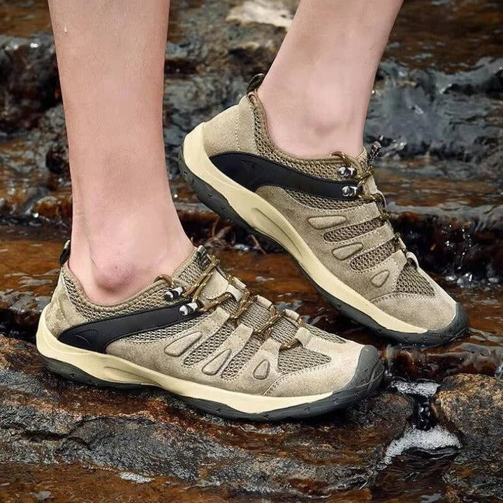 Comfortable women's hiking shoes with ankle support. Waterproof all-terrain trail shoes for active wear.