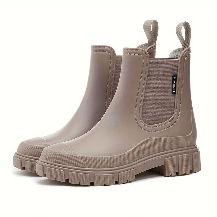 Fashionable women's ankle Chelsea boots, waterproof and comfortable, perfect casual footwear for wet weather.