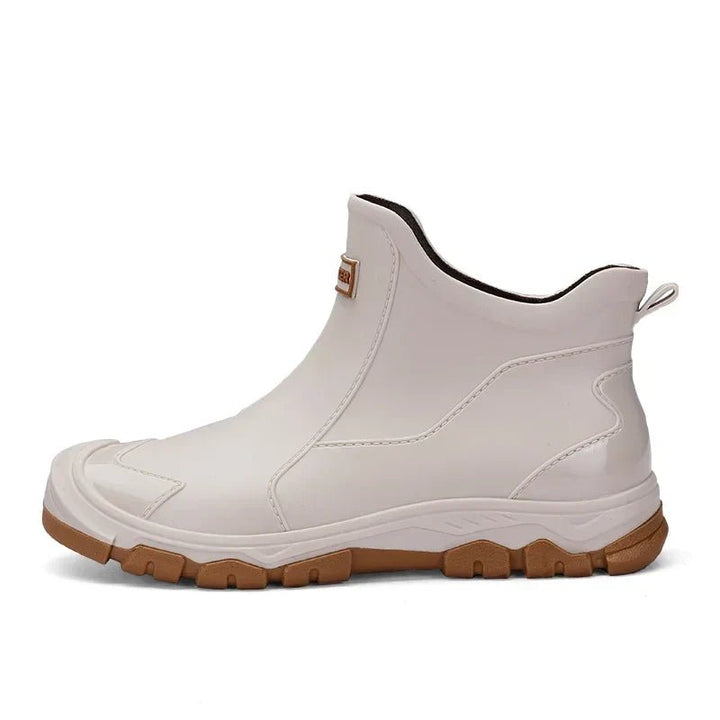 All-season women's waterproof Chelsea boots, sturdy slip-on ankle rain boots ensuring comfort in wet conditions.