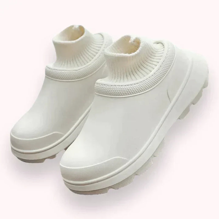 Women's waterproof slip-on clogs with cozy knitted ankle cuff & non-slip sole for comfortable everyday wear.