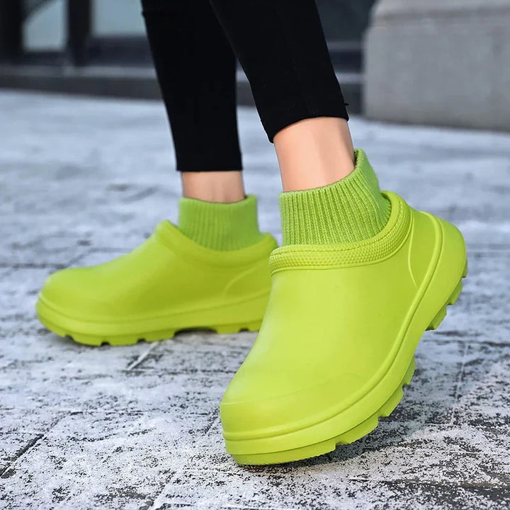 Side view: Madeline women's waterproof slip-on clogs, highlighting the cozy knitted ankle cuff & non-slip sole.