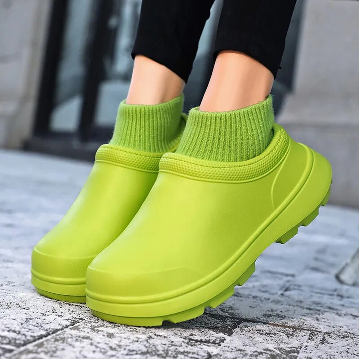 Front view: Women's waterproof slip-on clogs with closed toe, cozy knitted ankle cuff, and supportive non-slip sole.