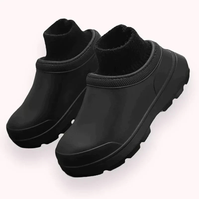 Waterproof women's slip-on clogs with a supportive closed-toe design, cozy ankle cuff, & durable non-slip sole.