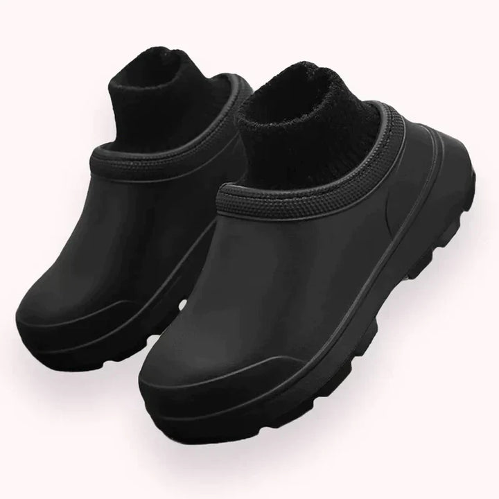Waterproof women's slip-on clogs with a supportive closed-toe design, cozy ankle cuff, & durable non-slip sole.