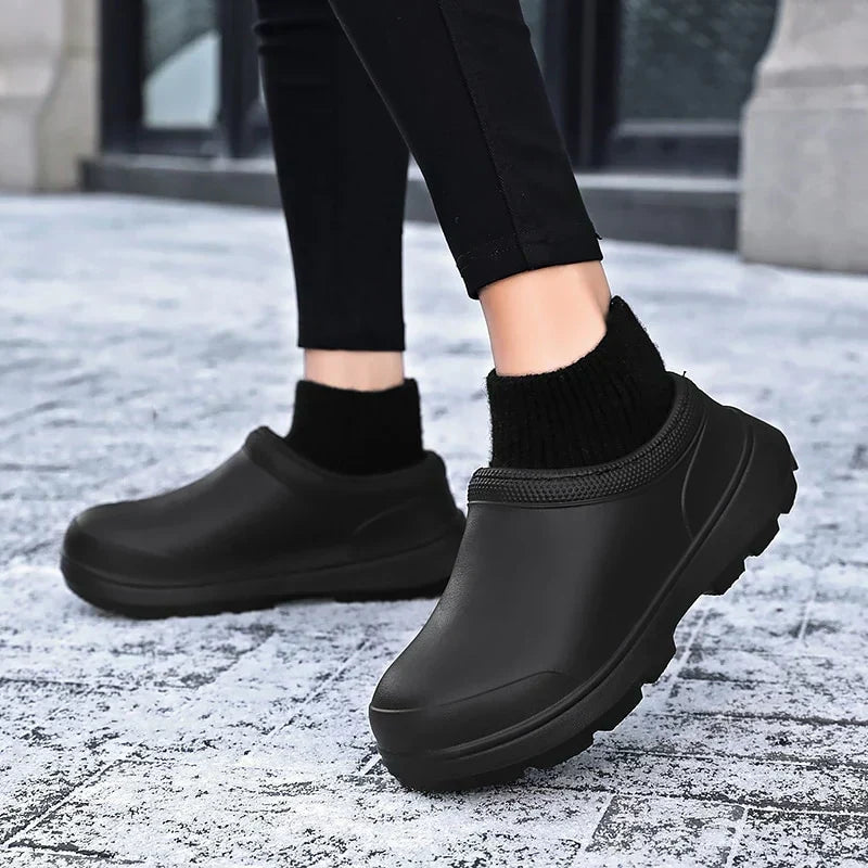 Supportive & cozy women's waterproof clogs with a slip-on design, knitted ankle cuff, & secure non-slip sole.