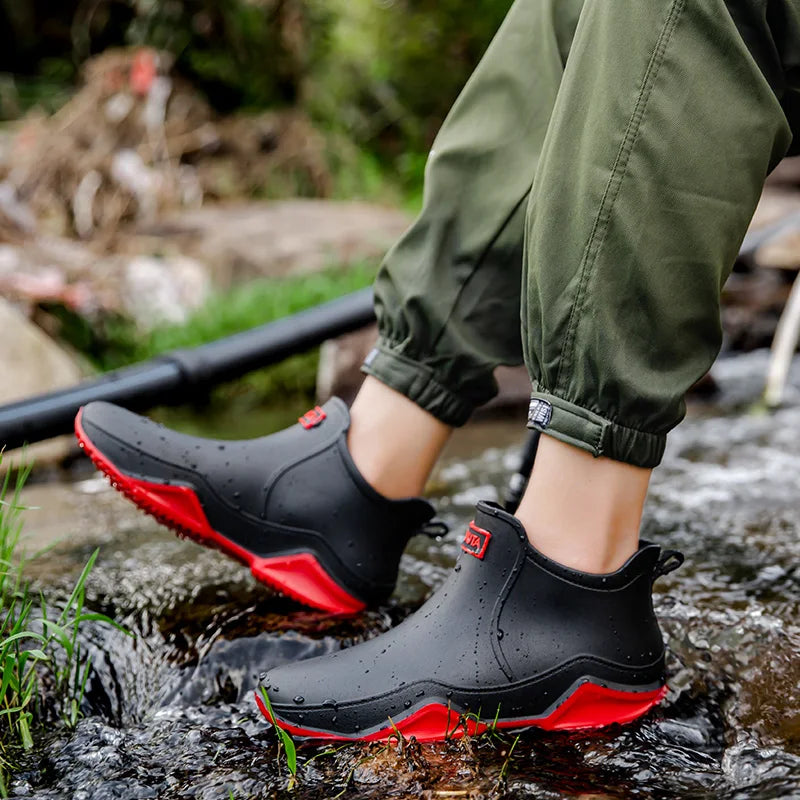 Classic black women's waterproof slip-on ankle rain boots, versatile and practical for any weather.