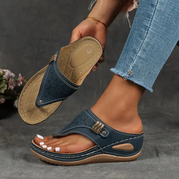 Elegant women's wedge sandals featuring a cutout design and stable sole. Ideal platform summer shoes.