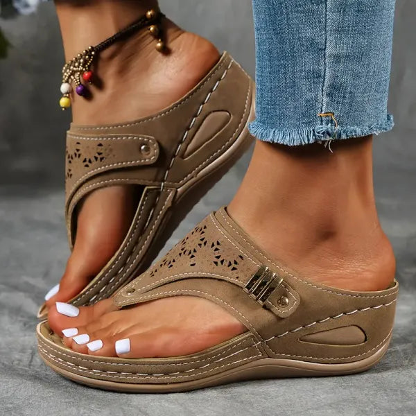 Comfortable women's open-toe wedge sandals with adjustable straps & stable platform for elegant summer wear.