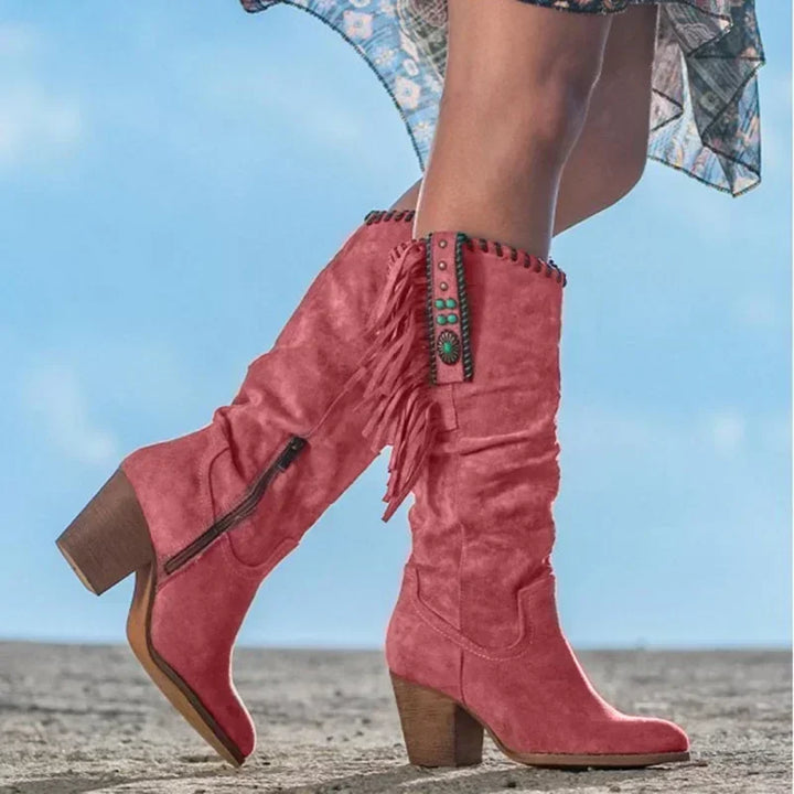 Women's western mid-calf boots with turquoise studs, fringe, slouchy design, and a comfortable block heel.